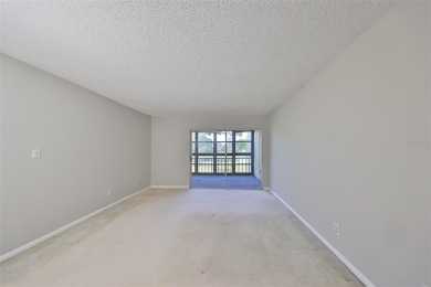 Location, location, location! This maintenance-free condo is on Emerald Greens Golf Resort and Country Club in Florida - for sale on GolfHomes.com, golf home, golf lot