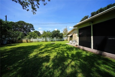 Across the street from GOLF COURSE and Playground ,this charming on Mangrove Bay Golf Course in Florida - for sale on GolfHomes.com, golf home, golf lot