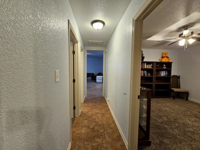 Beautiful 4-bed, 2-bath home just steps from the Andrews County on Andrews County Golf Course in Texas - for sale on GolfHomes.com, golf home, golf lot