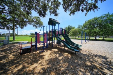 Across the street from GOLF COURSE and Playground ,this charming on Mangrove Bay Golf Course in Florida - for sale on GolfHomes.com, golf home, golf lot