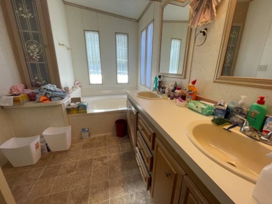 Swiss Golf & Tennis Lot 758 2 bedroom 2 bath 1568 SQ FT Listed on Lake Henry Golf Club in Florida - for sale on GolfHomes.com, golf home, golf lot