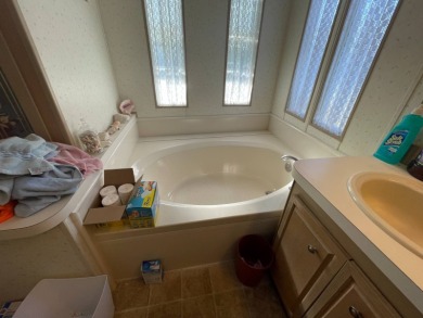 Swiss Golf & Tennis Lot 758 2 bedroom 2 bath 1568 SQ FT Listed on Lake Henry Golf Club in Florida - for sale on GolfHomes.com, golf home, golf lot