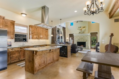 Discover this charming Hill Country Spanish-style Casita on Apple Rock Golf Course - Horseshoe Bay in Texas - for sale on GolfHomes.com, golf home, golf lot