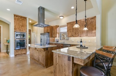 Discover this charming Hill Country Spanish-style Casita on Apple Rock Golf Course - Horseshoe Bay in Texas - for sale on GolfHomes.com, golf home, golf lot