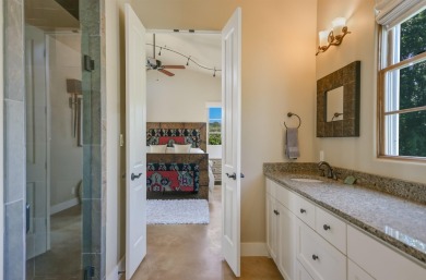 Discover this charming Hill Country Spanish-style Casita on Apple Rock Golf Course - Horseshoe Bay in Texas - for sale on GolfHomes.com, golf home, golf lot