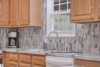 Pride of ownership shines throughout this beautiful home in on Lochen Heath Golf Course in Michigan - for sale on GolfHomes.com, golf home, golf lot