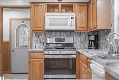 Pride of ownership shines throughout this beautiful home in on Lochen Heath Golf Course in Michigan - for sale on GolfHomes.com, golf home, golf lot