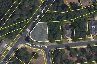 Discover the perfect setting for your dream home on this corner on Carolina National Golf Club in North Carolina - for sale on GolfHomes.com, golf home, golf lot