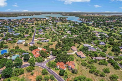 Discover this charming Hill Country Spanish-style Casita on Apple Rock Golf Course - Horseshoe Bay in Texas - for sale on GolfHomes.com, golf home, golf lot