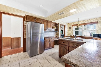 Enjoy beautiful curb appeal, directly across from 58 acre on Sherrill Park Golf Course in Texas - for sale on GolfHomes.com, golf home, golf lot