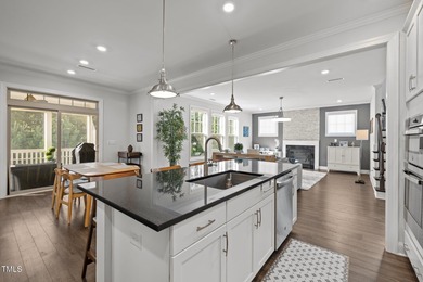 Step inside to sun-filled, open-concept living with a gourmet on The Preserve At Jordan Lake Golf Club in North Carolina - for sale on GolfHomes.com, golf home, golf lot