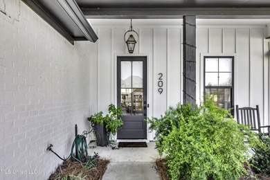 This welcoming Lake Caroline Home in Madison, MS offers high on Lake Caroline Golf Club in Mississippi - for sale on GolfHomes.com, golf home, golf lot