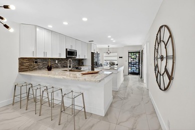 Step into luxury living with this recently and beautifully on Villa Del Ray Golf Club in Florida - for sale on GolfHomes.com, golf home, golf lot