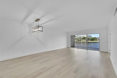 Immediately as you enter the foyer of this BRAND NEW renovated on Palm-Aire Country Club and Resort - Palms in Florida - for sale on GolfHomes.com, golf home, golf lot
