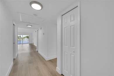 Immediately as you enter the foyer of this BRAND NEW renovated on Palm-Aire Country Club and Resort - Palms in Florida - for sale on GolfHomes.com, golf home, golf lot