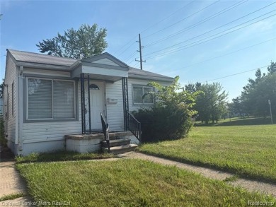 CUTE COZY 3 BEDROOM RANCH. LOCATED RIGHT ACROSS THE STREET FROM on The Links At Crystal Lake in Michigan - for sale on GolfHomes.com, golf home, golf lot