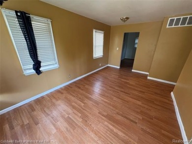 CUTE COZY 3 BEDROOM RANCH. LOCATED RIGHT ACROSS THE STREET FROM on The Links At Crystal Lake in Michigan - for sale on GolfHomes.com, golf home, golf lot