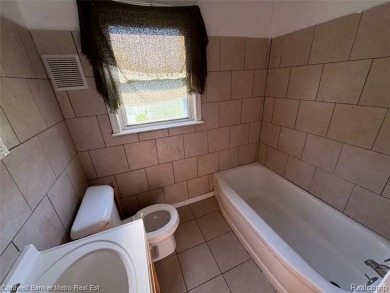CUTE COZY 3 BEDROOM RANCH. LOCATED RIGHT ACROSS THE STREET FROM on The Links At Crystal Lake in Michigan - for sale on GolfHomes.com, golf home, golf lot