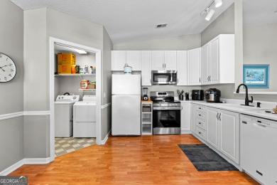 Welcome home to this charming 2-bedroom, 2-bath end-unit cottage on Braelinn Golf Club in Georgia - for sale on GolfHomes.com, golf home, golf lot