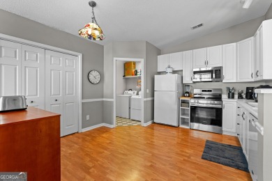 Welcome home to this charming 2-bedroom, 2-bath end-unit cottage on Braelinn Golf Club in Georgia - for sale on GolfHomes.com, golf home, golf lot