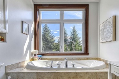 Aiglon prestigious center unit  townhome with upgrades, spacious on Golf Manitou in  - for sale on GolfHomes.com, golf home, golf lot