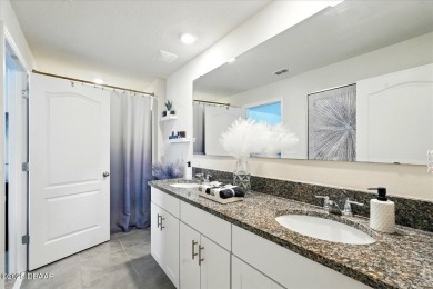 This stunning 2022 modern home in Venetian Bay is priced under on Venetian Bay Golf Course in Florida - for sale on GolfHomes.com, golf home, golf lot