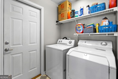 Welcome home to this charming 2-bedroom, 2-bath end-unit cottage on Braelinn Golf Club in Georgia - for sale on GolfHomes.com, golf home, golf lot