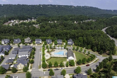 Located in the charming enclave of Sawyer Trail, this 4-bedroom on Ross Bridge Golf Resort in Alabama - for sale on GolfHomes.com, golf home, golf lot
