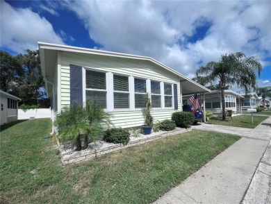 This stunning, partically furnished residence offers an inviting on Fairway Village Golf Course in Florida - for sale on GolfHomes.com, golf home, golf lot