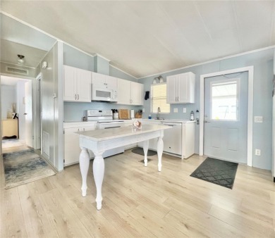 This stunning, partically furnished residence offers an inviting on Fairway Village Golf Course in Florida - for sale on GolfHomes.com, golf home, golf lot