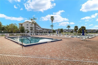 Stunning Condo with GOLF and WATER FEATURES in Vibrant Community on Golfview Golf and Racquet Club in Florida - for sale on GolfHomes.com, golf home, golf lot