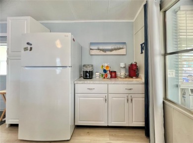 This stunning, partically furnished residence offers an inviting on Fairway Village Golf Course in Florida - for sale on GolfHomes.com, golf home, golf lot