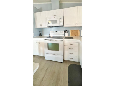 This stunning, partically furnished residence offers an inviting on Fairway Village Golf Course in Florida - for sale on GolfHomes.com, golf home, golf lot