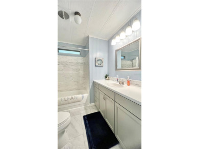 This stunning, partically furnished residence offers an inviting on Fairway Village Golf Course in Florida - for sale on GolfHomes.com, golf home, golf lot