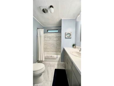 This stunning, partically furnished residence offers an inviting on Fairway Village Golf Course in Florida - for sale on GolfHomes.com, golf home, golf lot