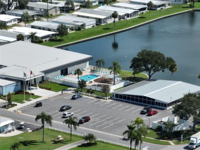 This stunning, partically furnished residence offers an inviting on Fairway Village Golf Course in Florida - for sale on GolfHomes.com, golf home, golf lot