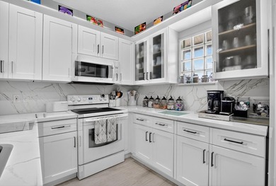 GORGEOUS CONDO WITH DESIREABLE WEST EXPOSURE , BEAUTIFULLY on Boca West Golf and Country Club in Florida - for sale on GolfHomes.com, golf home, golf lot