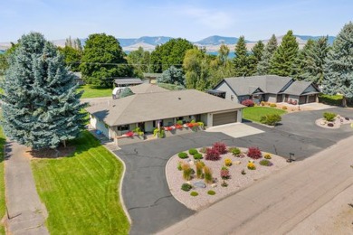 Park in the circular drive and enter this lovely home just on Polson Bay Golf Course - Championship Course in Montana - for sale on GolfHomes.com, golf home, golf lot