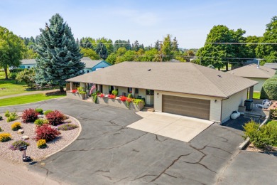 Park in the circular drive and enter this lovely home just on Polson Bay Golf Course - Championship Course in Montana - for sale on GolfHomes.com, golf home, golf lot