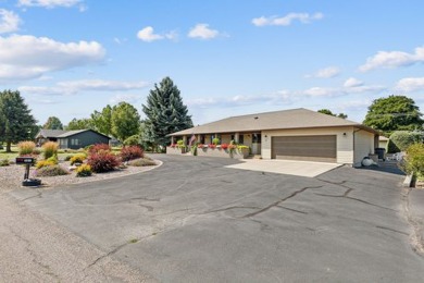 Park in the circular drive and enter this lovely home just on Polson Bay Golf Course - Championship Course in Montana - for sale on GolfHomes.com, golf home, golf lot