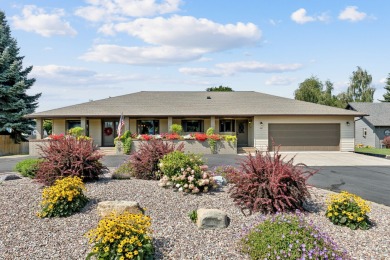 Park in the circular drive and enter this lovely home just on Polson Bay Golf Course - Championship Course in Montana - for sale on GolfHomes.com, golf home, golf lot