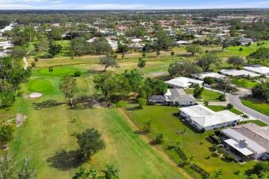 Under contract-accepting backup offers. Charming Golf Course on Village Green Golf Club of Sarasota in Florida - for sale on GolfHomes.com, golf home, golf lot