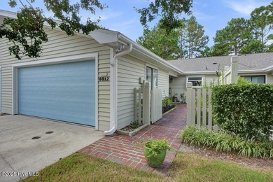 Welcome to low-maintenance living with thoughtful updates and on Inland Greens Golf Course in North Carolina - for sale on GolfHomes.com, golf home, golf lot