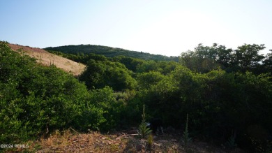 Stunning downhill building lot with magnificent 180 degree views on Talisker Club At Tuhaye in Utah - for sale on GolfHomes.com, golf home, golf lot