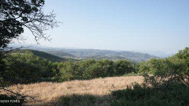Stunning downhill building lot with magnificent 180 degree views on Talisker Club At Tuhaye in Utah - for sale on GolfHomes.com, golf home, golf lot