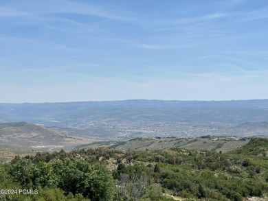 Stunning downhill building lot with magnificent 180 degree views on Talisker Club At Tuhaye in Utah - for sale on GolfHomes.com, golf home, golf lot