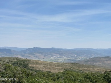 Stunning downhill building lot with magnificent 180 degree views on Talisker Club At Tuhaye in Utah - for sale on GolfHomes.com, golf home, golf lot
