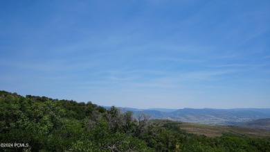 Stunning downhill building lot with magnificent 180 degree views on Talisker Club At Tuhaye in Utah - for sale on GolfHomes.com, golf home, golf lot