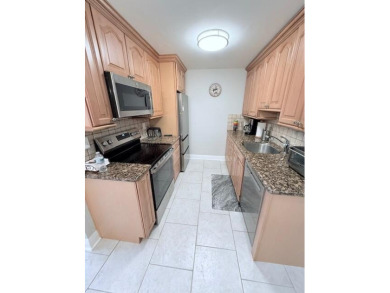 A most desirable waterfront location near pooles beautifully on Hillsboro Pines Golf in Florida - for sale on GolfHomes.com, golf home, golf lot