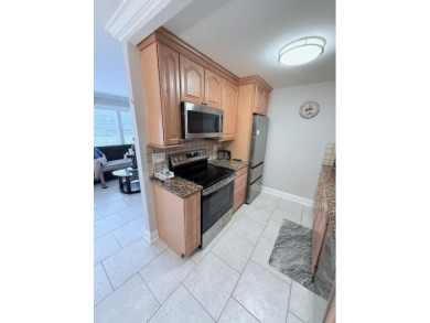 A most desirable waterfront location near pooles beautifully on Hillsboro Pines Golf in Florida - for sale on GolfHomes.com, golf home, golf lot